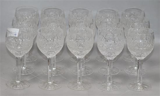 A quantity of mixed cut glass wine glasses height 17cm